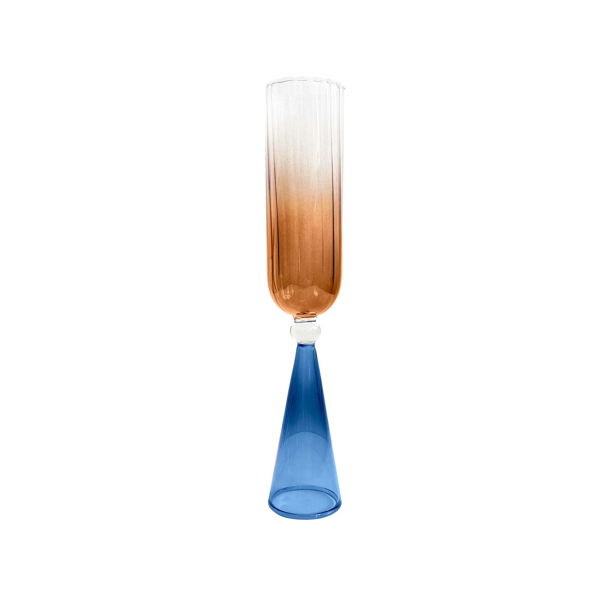 A single bespoke & handblown borosilicate champagne glass with gradient amber color, curved rim. Azure blue stand on a white background