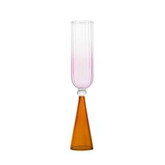 A single bespoke & handblown borosilicate champagne glass with gradient rose pink color, curved edged rim. Amber reddish-coloured stand on a white background. Designed for stemware use.